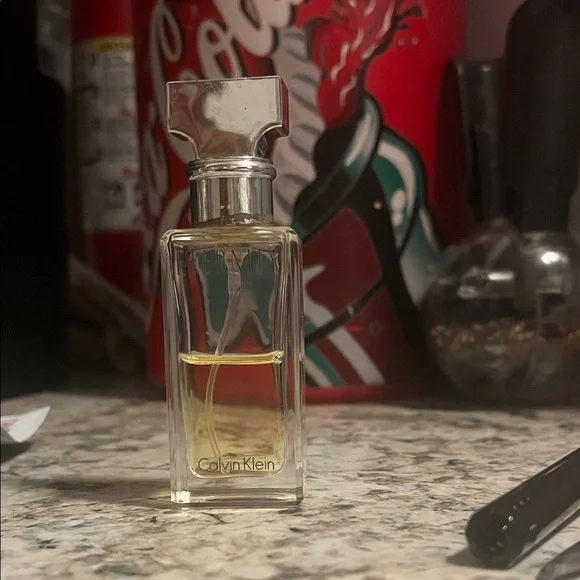eternity Calvin Klein Clear Glass Perfume with Silver Cap. HALF FULL - Picture 1 of 2